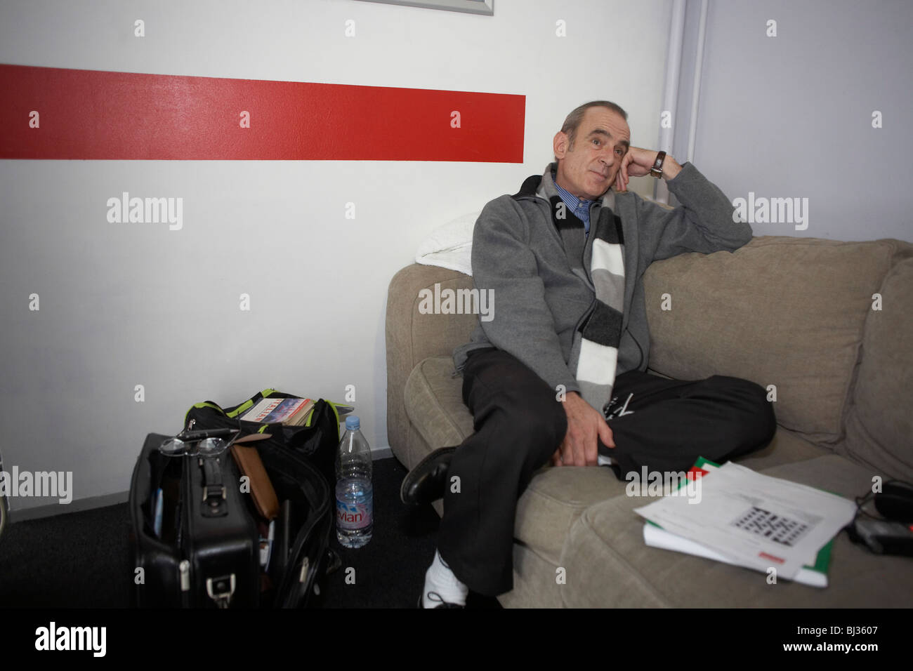 Francis Rossi of the rock band Status Quo relaxes in a dressing room at L'Aeronef in Lille, France. Stock Photo