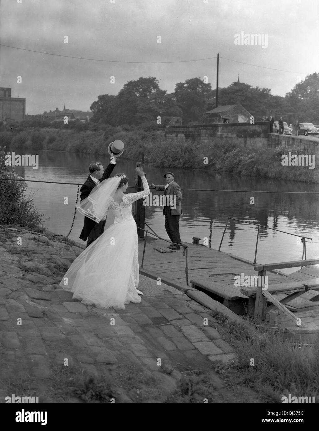 Wedding couple crossing the river Don, Mexborough, South Yorkshire, 1961.  Artist: Michael Walters Stock Photo