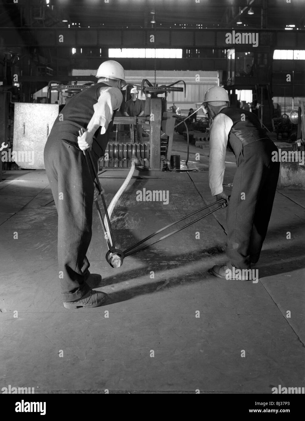 Rolling steel bars, Park Gate Iron & Steel Co, Rotherham, South Yorkshire, 1964. Artist Michael