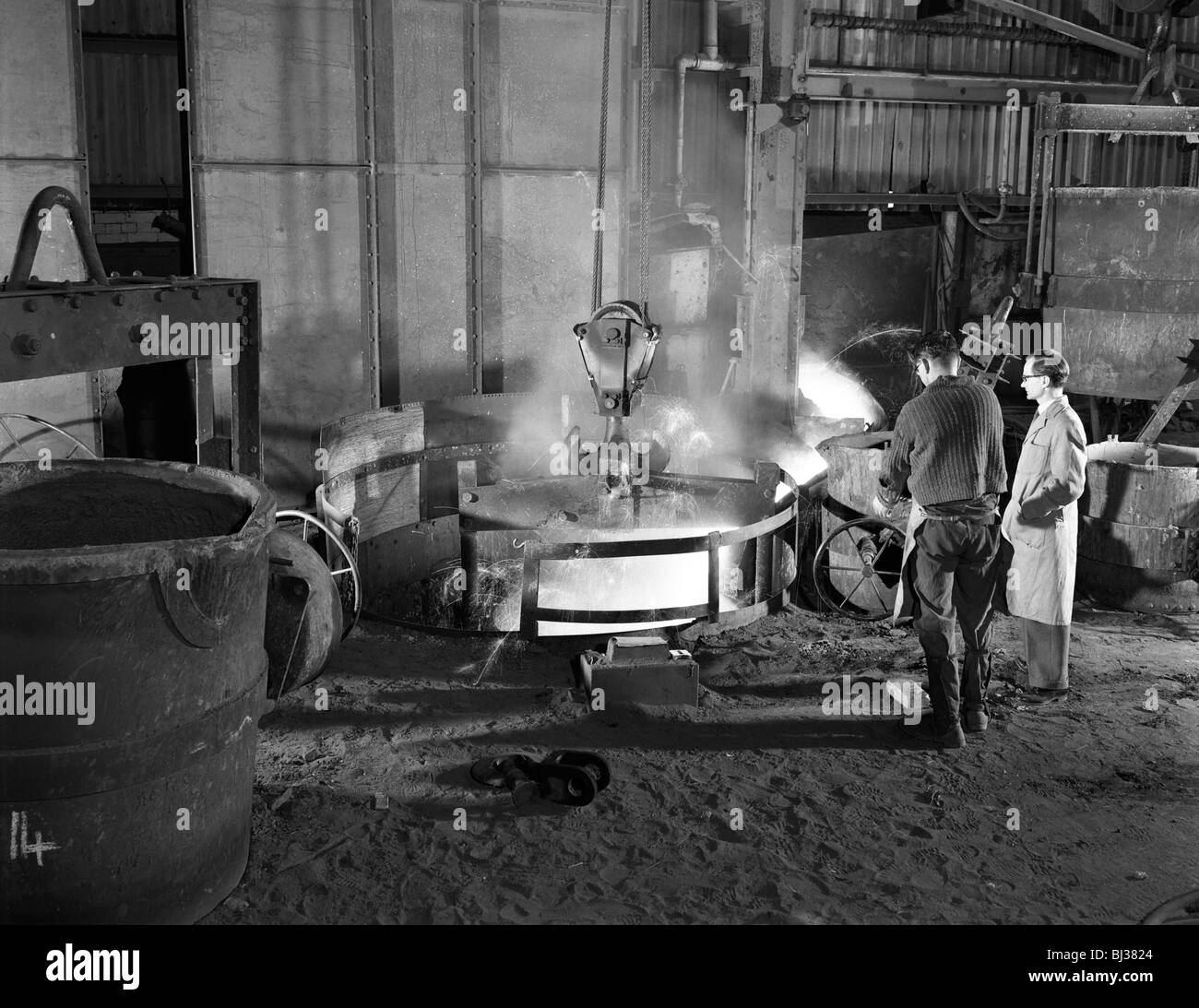 Looking into a melting furnace in a foundry for aluminum casting