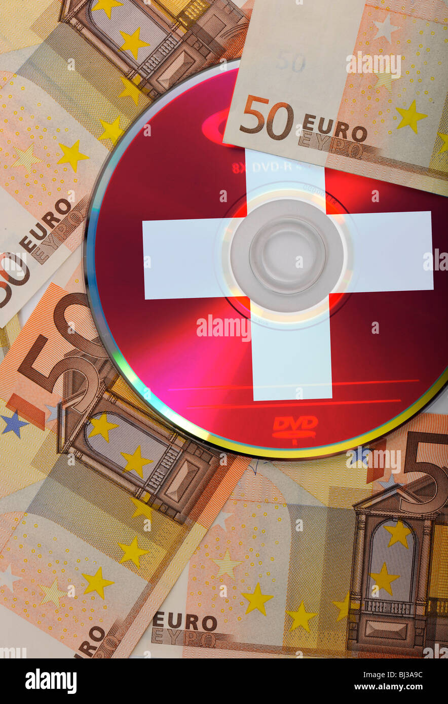 DVD, CD, euro bills, national flag of Switzerland, symbolic image for the purchase of bank records, tax evasion, banking confid Stock Photo