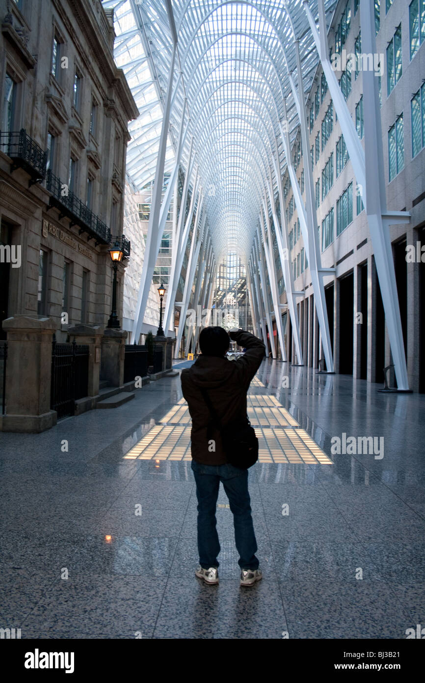 A photographer taking picture of the famous arch support structure