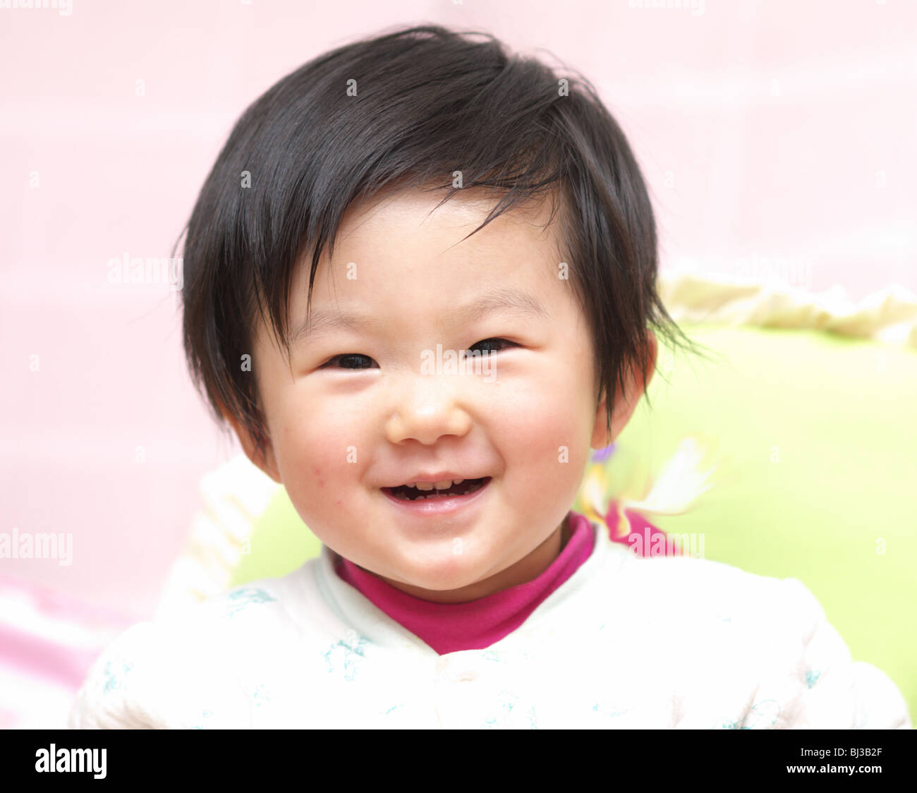 Asian baby girl smiling Stock Photo - Alamy
