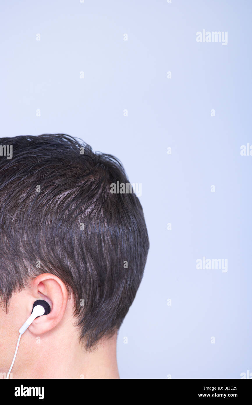 profile head cropped, headphone in ear Stock Photo Alamy