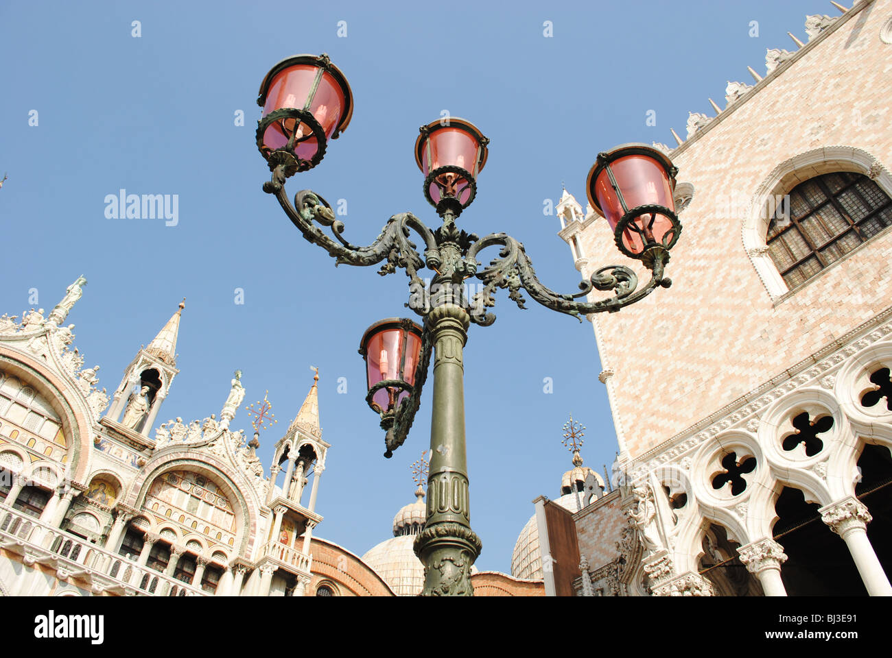 A pink street light in front of St Mark's Basilica and the Doge's Palace in St Mark's Square, Venice, Italy Stock Photo