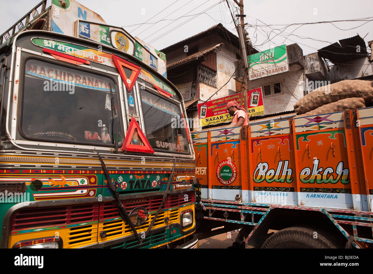 India, Kerala, Calicut, Kozhikode, Big Bazaar, decorated trucks from Maharashtra being unloaded Stock Photo