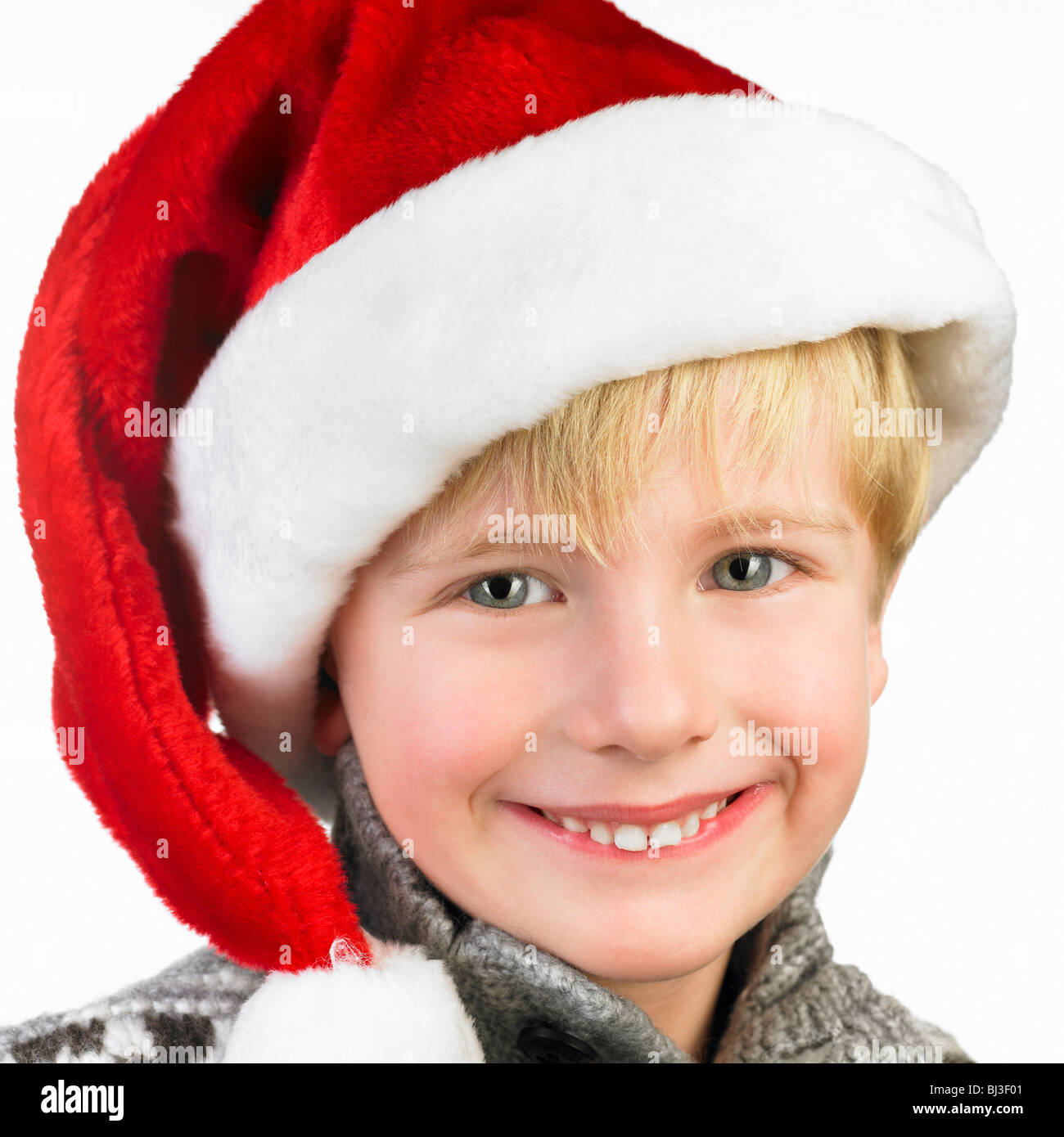 Boy wearing a christmas hat Stock Photo Alamy