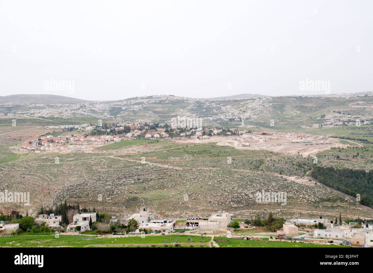 Israel, West Bank, Village in the Judaea desert, as seen from Herodion a castle fortress built by King Herod 20 B.C.E. Stock Photo