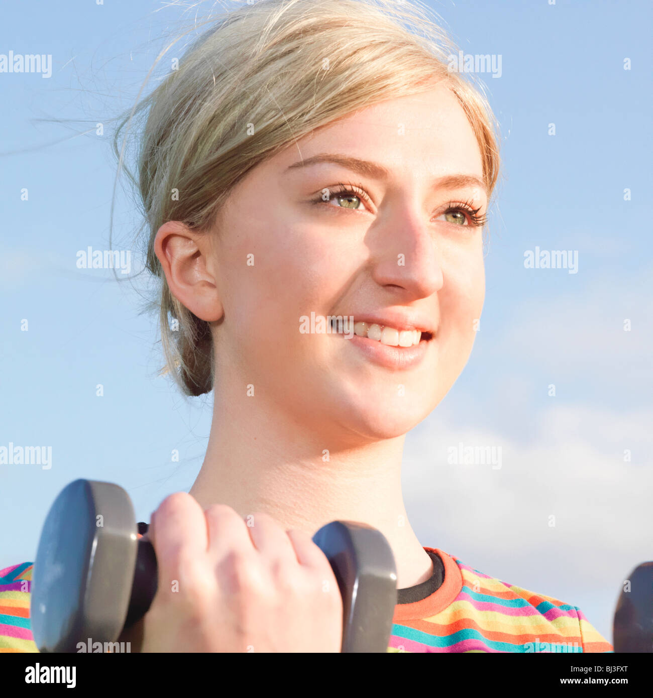 close up woman with dumbbells Stock Photo