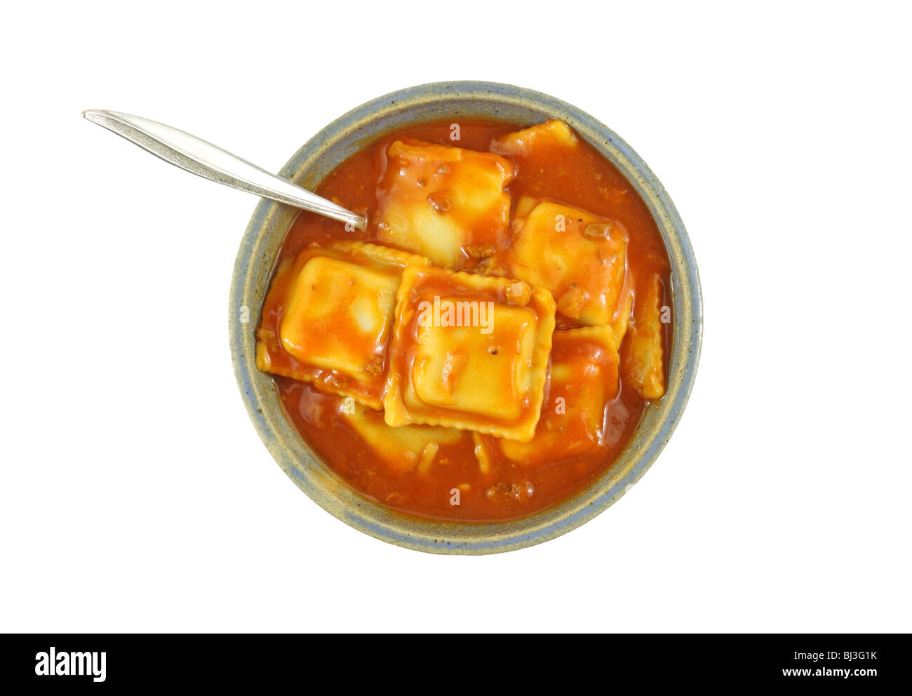 Beef ravioli with fork in a bowl Stock Photo
