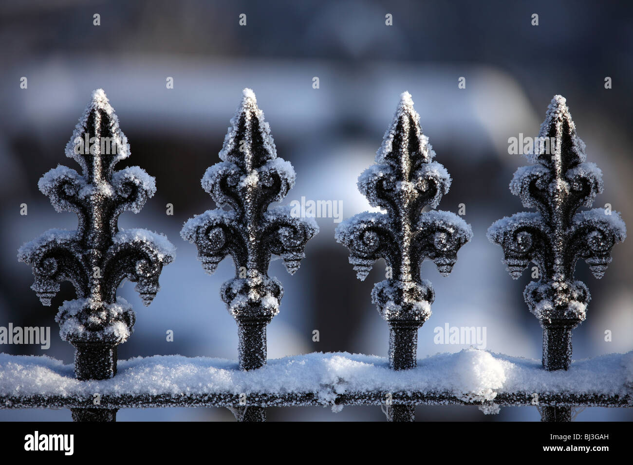 Frost covered railings outside a graveyard Stock Photo