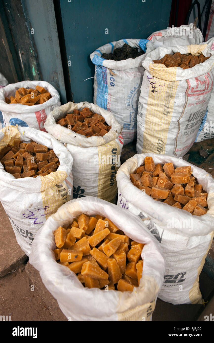 India, Kerala, Calicut, Kozhikode, Halwa Bazaar, sacks of jaggery, raw unrefined sugar on display in food wholesaler Stock Photo