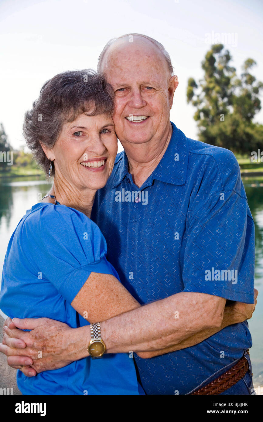 Happy Senior Married couple older elderly people person 70 -80 hugging closely linked  content contentment contented United States MR  © Myrleen Pearson Stock Photo