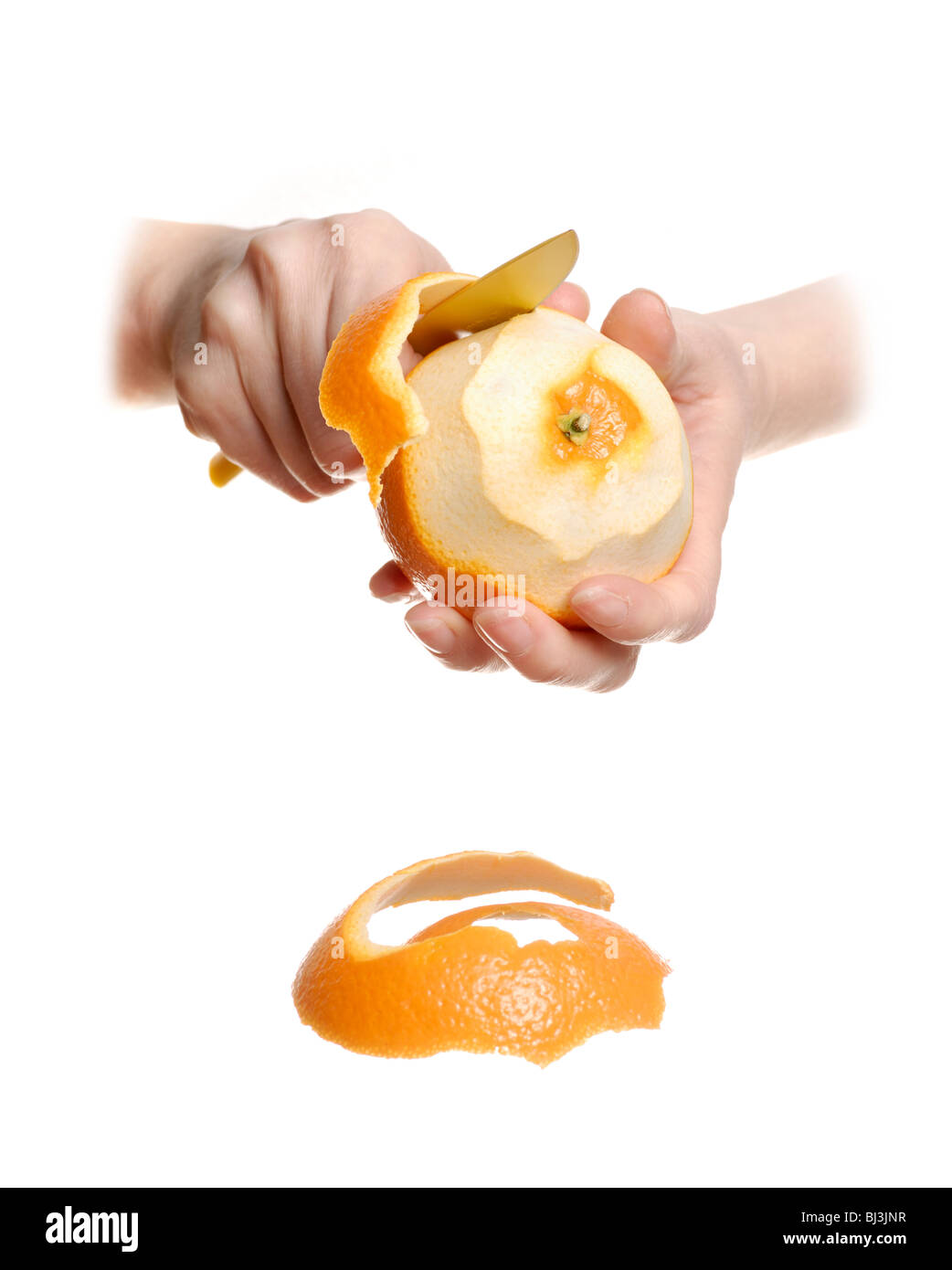 Peeling an orange Stock Photo Alamy