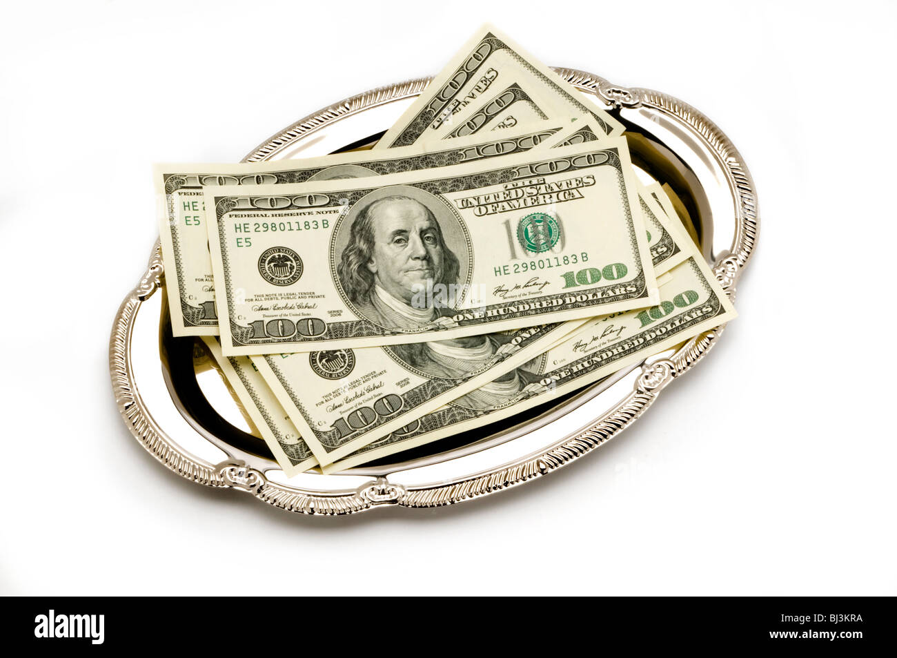 American money on silver tray platter Stock Photo