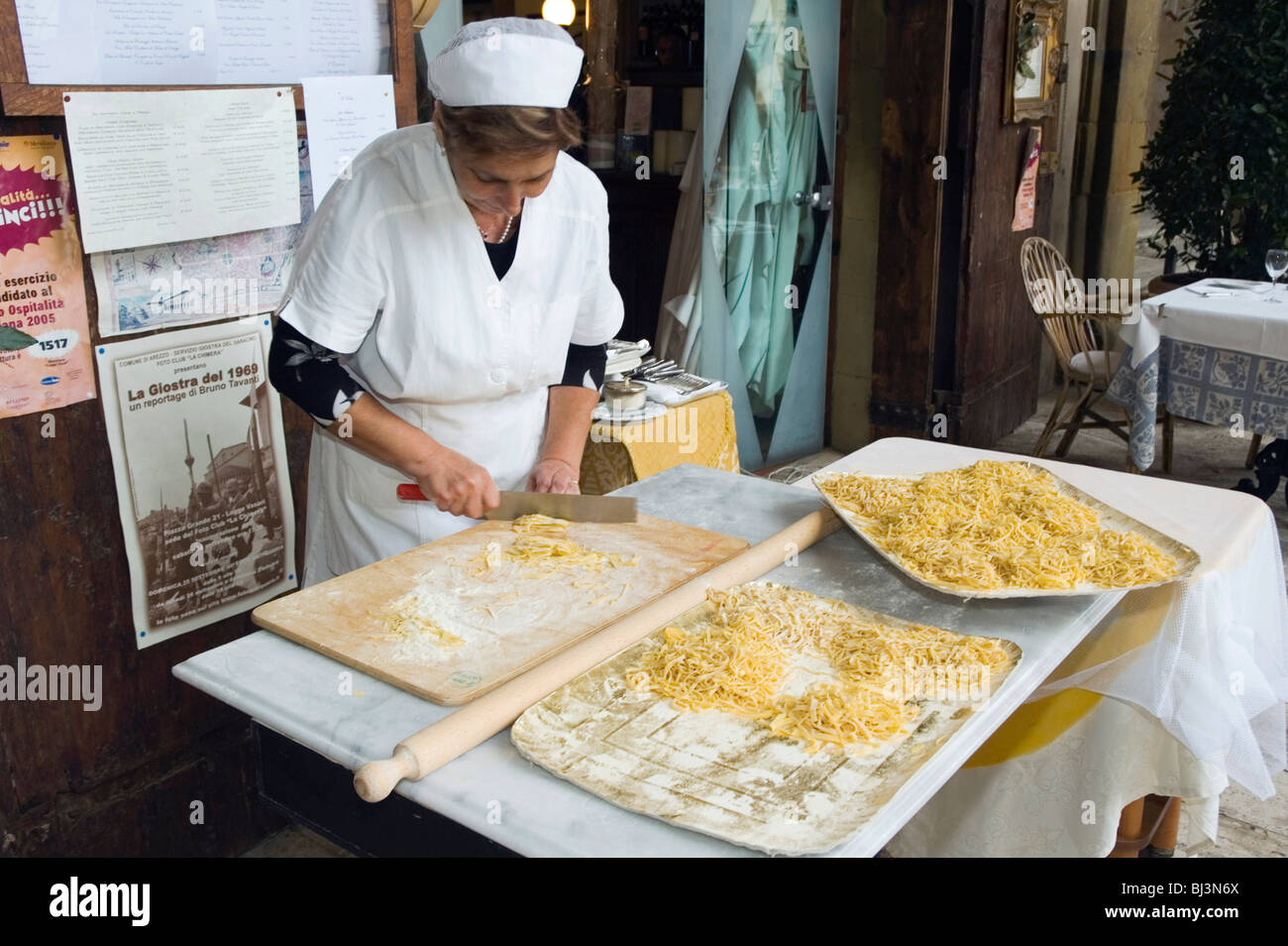 Woman making pasta, Trattoria Logge Vasari, Piazza Grande, Arezzo, Tuscany, Italy, Europe Stock Photo