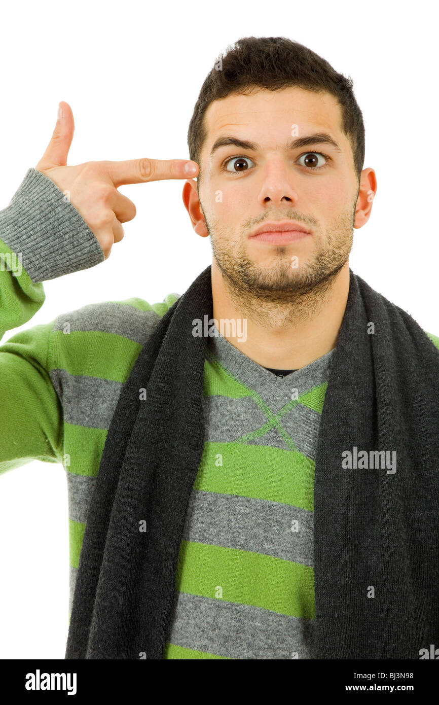 young man pointing to his head in simulation of suicide Stock Photo