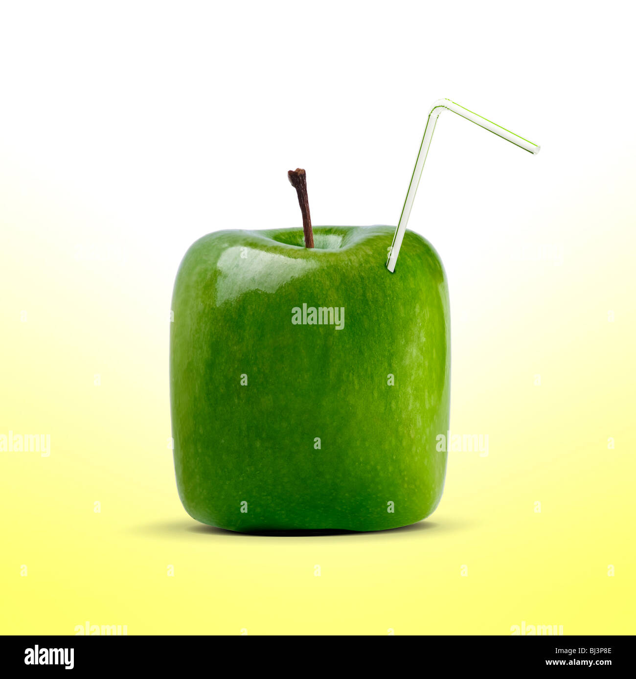 carton shaped apple juice with straw Stock Photo