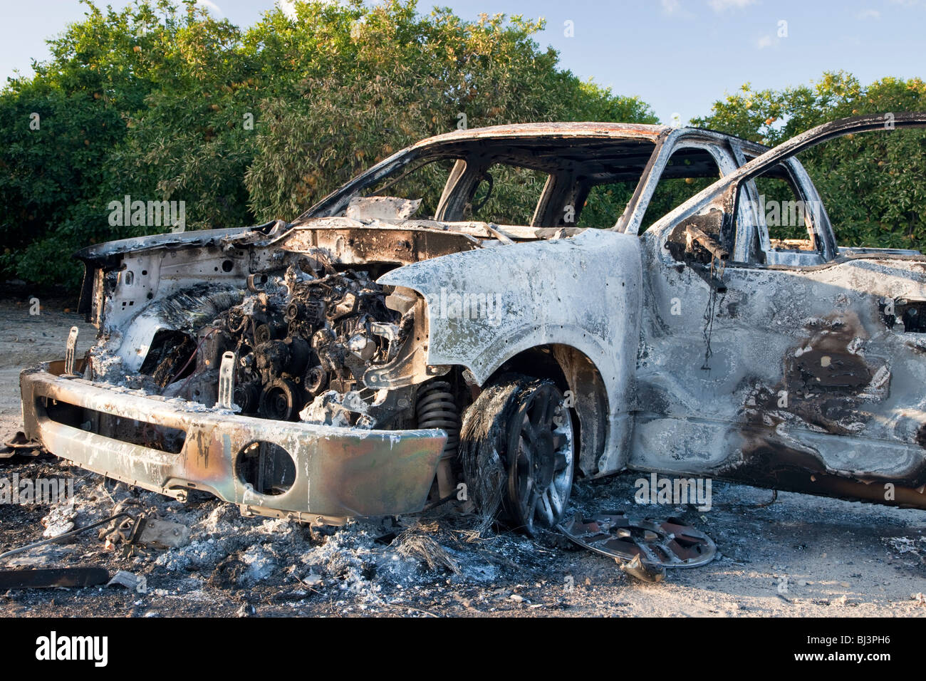 Torched 'compact' stolen pickup. Stock Photo