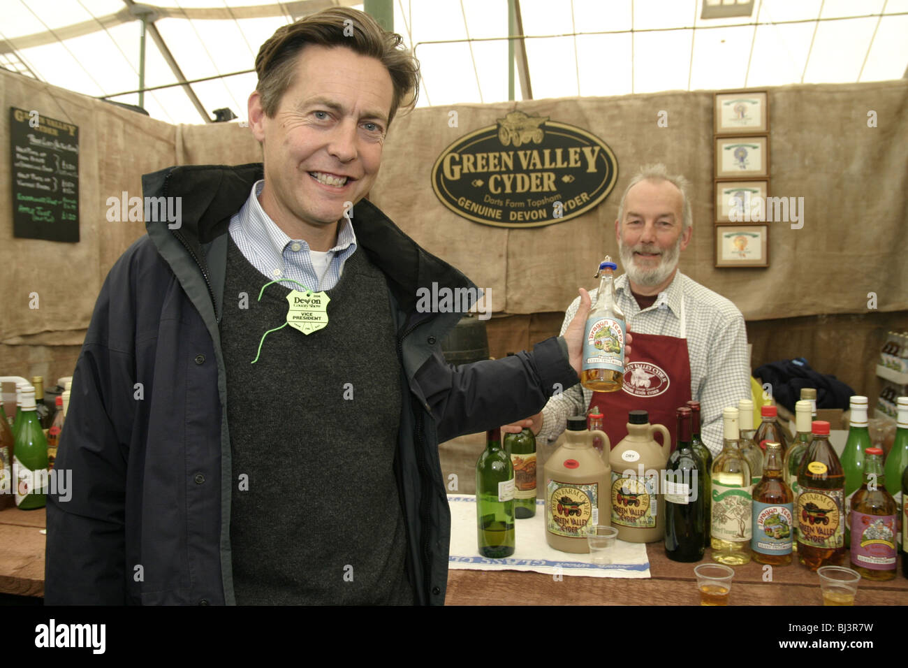 Ben Bradshaw MP for Exeter UK  at a cider maker's stall Devon County Show 2006 when Environment Minister holding bottle Stock Photo