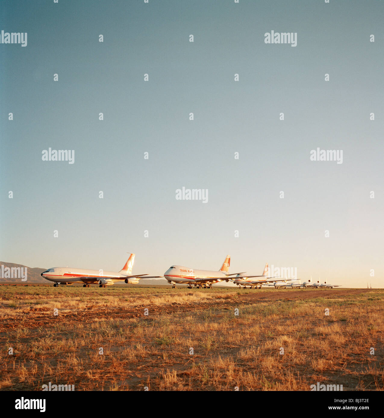 In mid-day heat of the arid Sonoran desert sit the remains of airliners at the storage facility at Mojave. Stock Photo