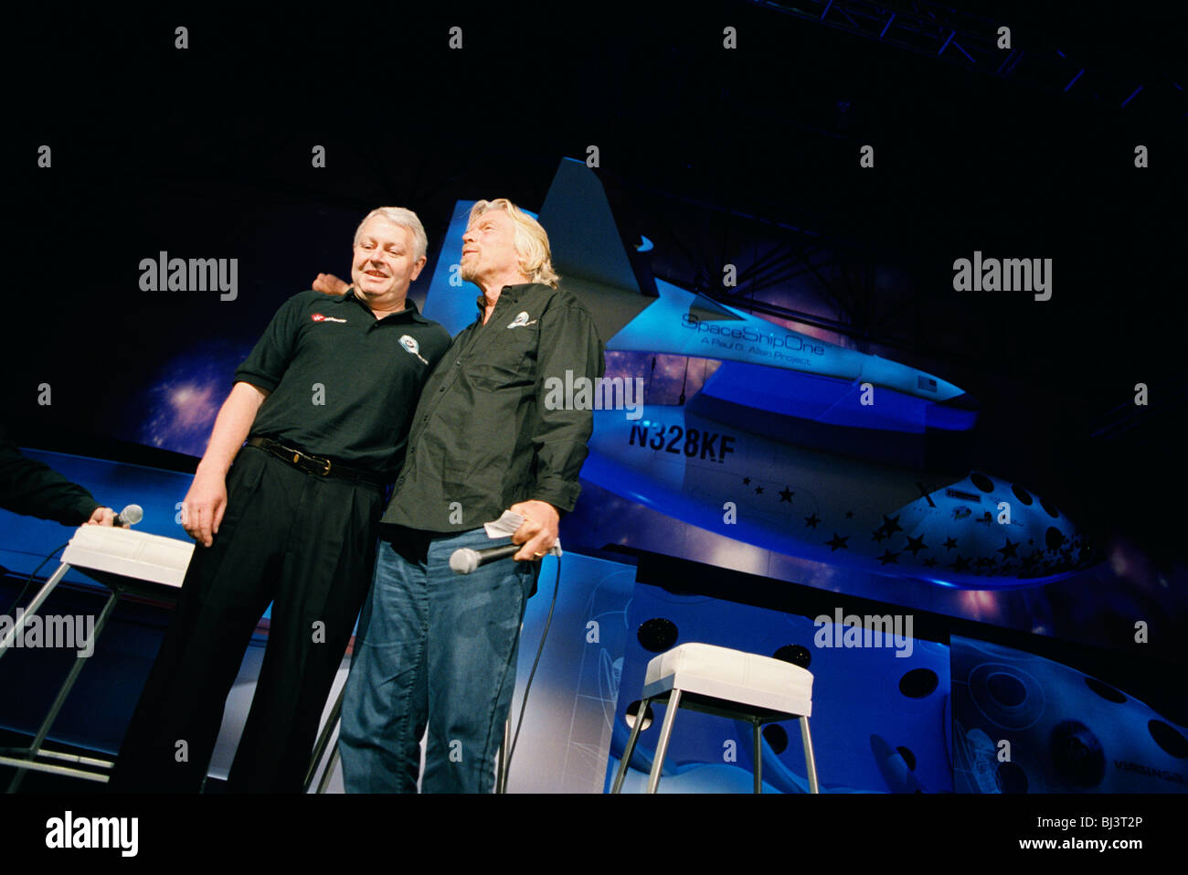Frequent flyer astronaut Alan Watts is presented to the media and space industry commentators by Sir Richard Branson Stock Photo
