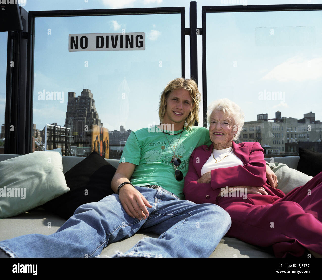 Sam and Eve Branson, son and mother of aviation tycoon Sir Richard, relax together on a roof terrace in Manhattan. Stock Photo