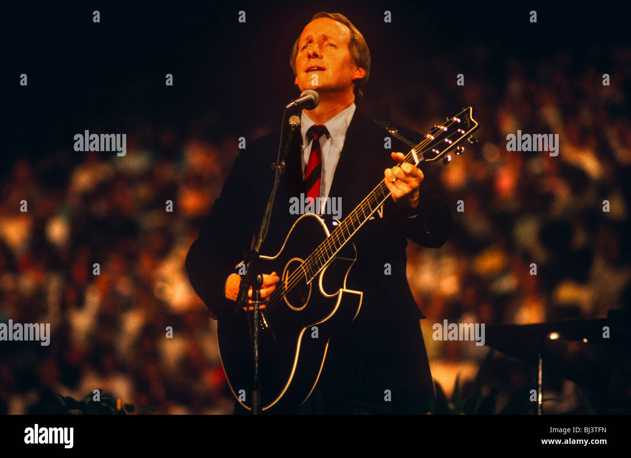 Country and Western singer George Hamilton IV performs in front of