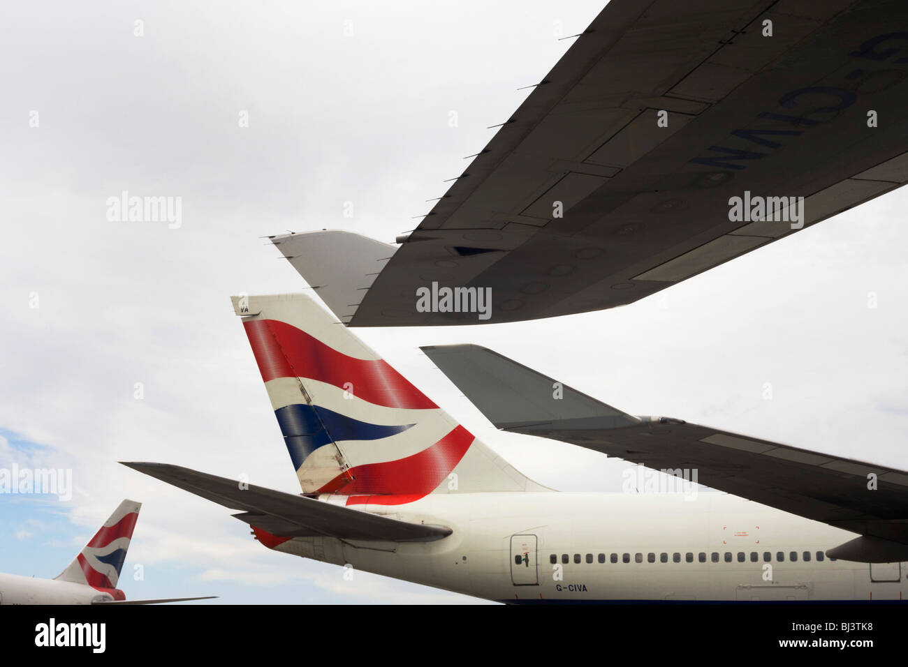 Wing tips and tails from British Airways 747-400 jet airliners are almost touching during their respective turnarounds. Stock Photo