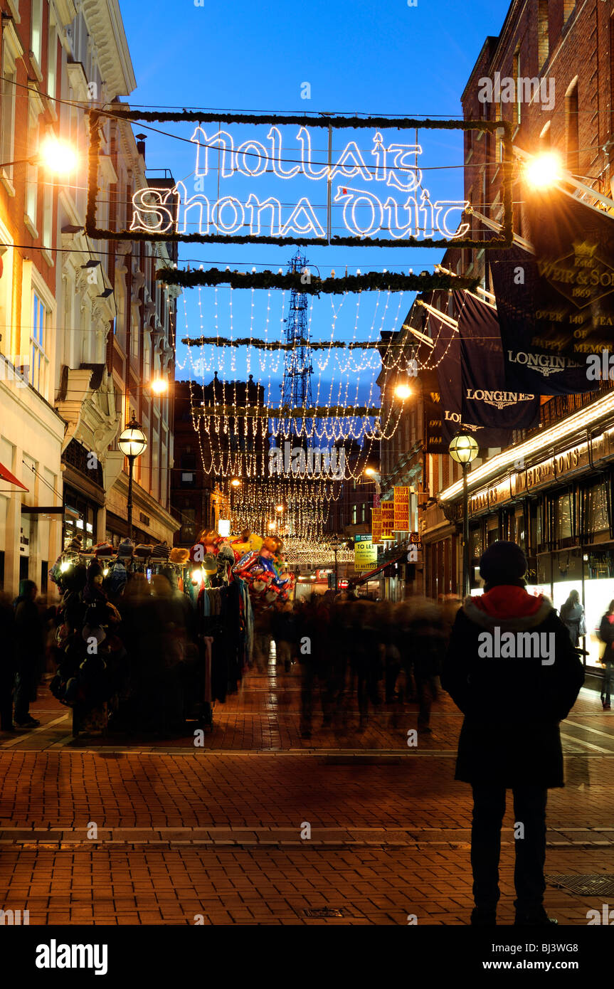 Christmas lights decorations Wicklow Street Dublin city Ireland traditional greeting Happy Christmas to you in Gaelic Stock Photo