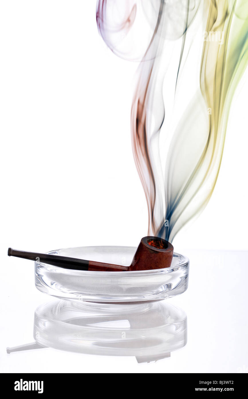 Colourful smoke from a pipe in an ashtray Stock Photo