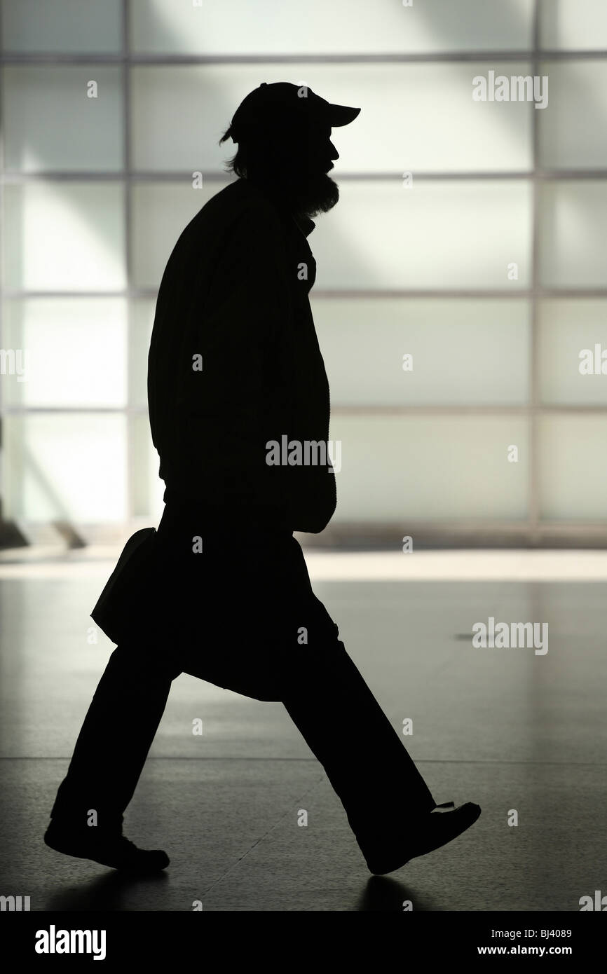 Silhouette of a man with a briefcase Stock Photo - Alamy