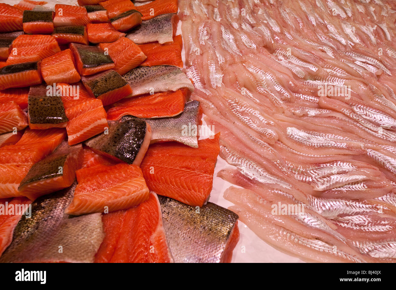 Salmon fillets and Cabillaud on fishmonger's slab - France. Stock Photo