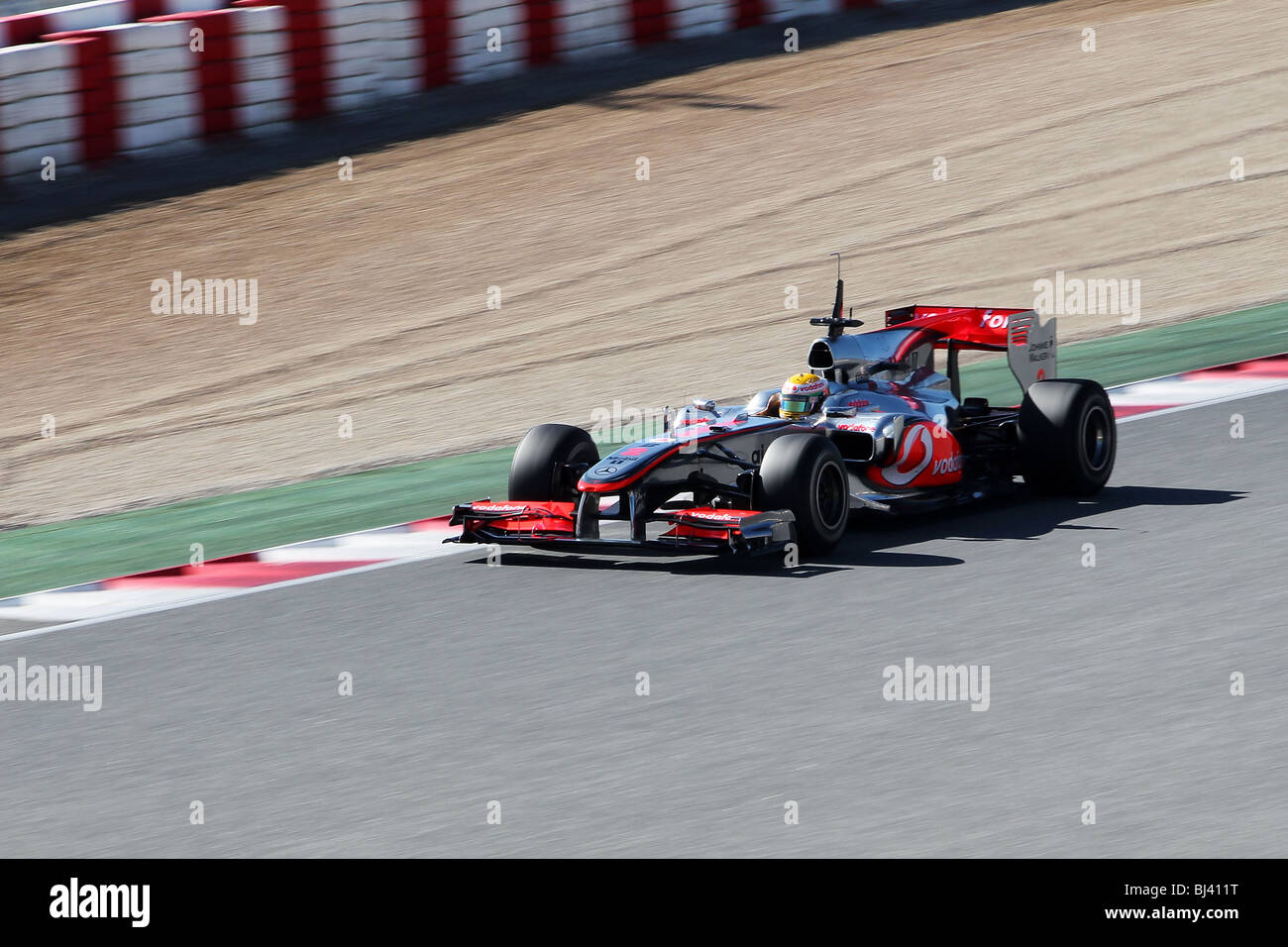 Lewis Hamilton driving the 2010 McLaren Mercedes Formula One car in Barcelona Stock Photo