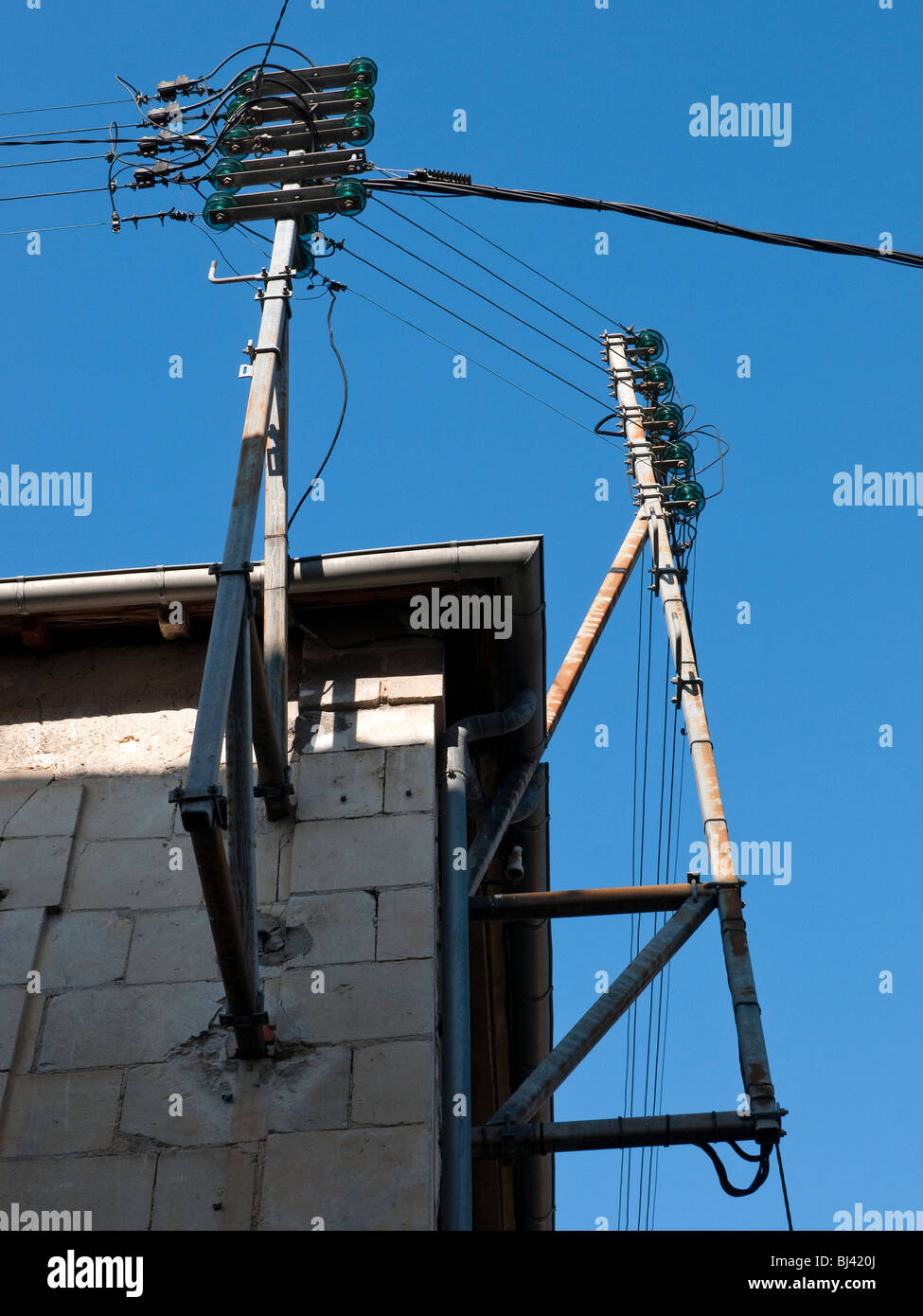 Old domestic mains electricity supply posts France Stock Photo Alamy