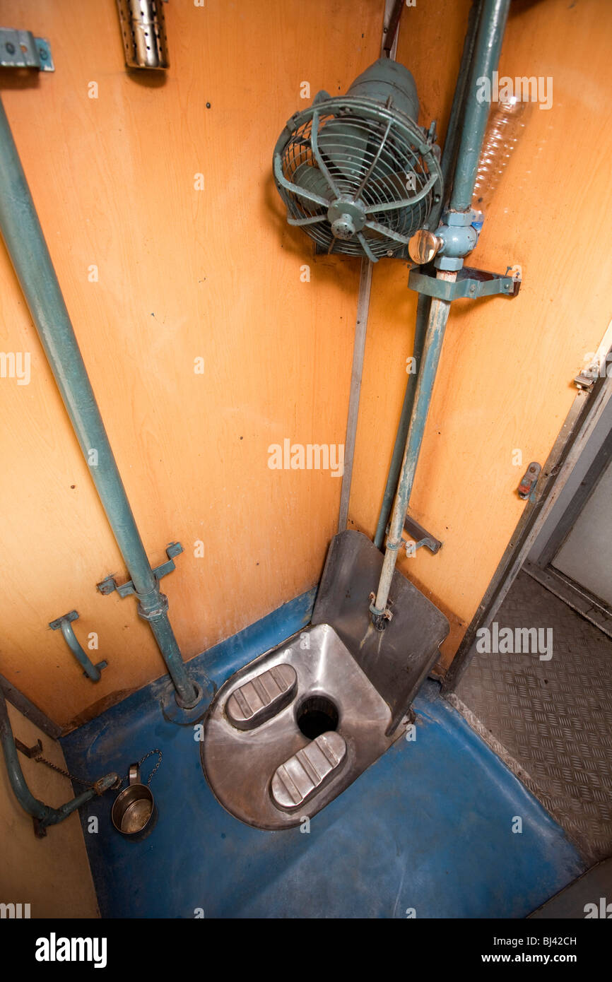 India, train travel, Indian style squat toilet of second class two tier air conditioned (2A) compartment Stock Photo