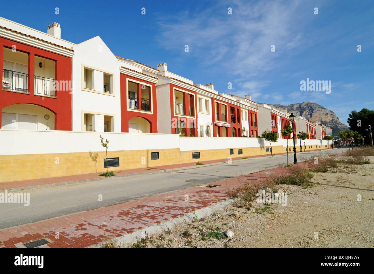 Colorful row houses, street, residential neighbourhood, village Jesus Pobre, Javea, Costa Blanca, Alicante province, Spain, Eur Stock Photo