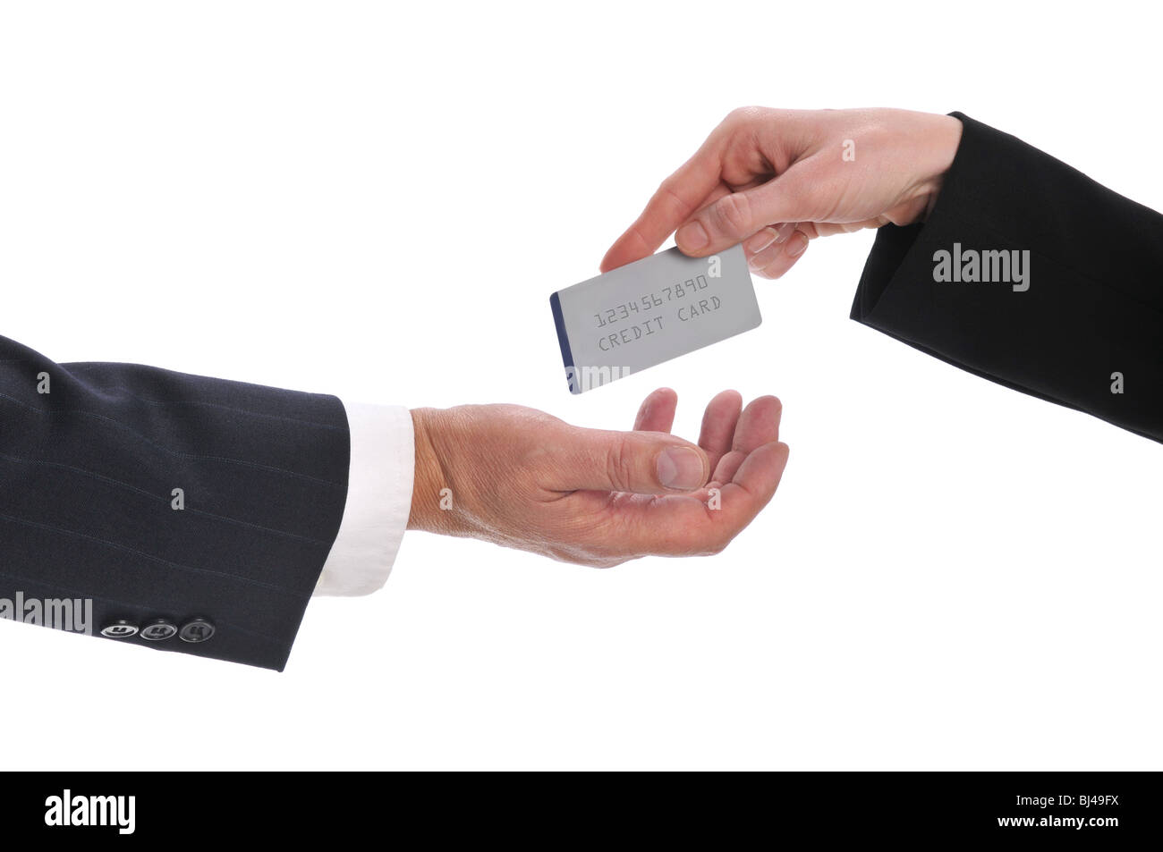 Woman's hand giving money to a businessman isolated on a white background Stock Photo