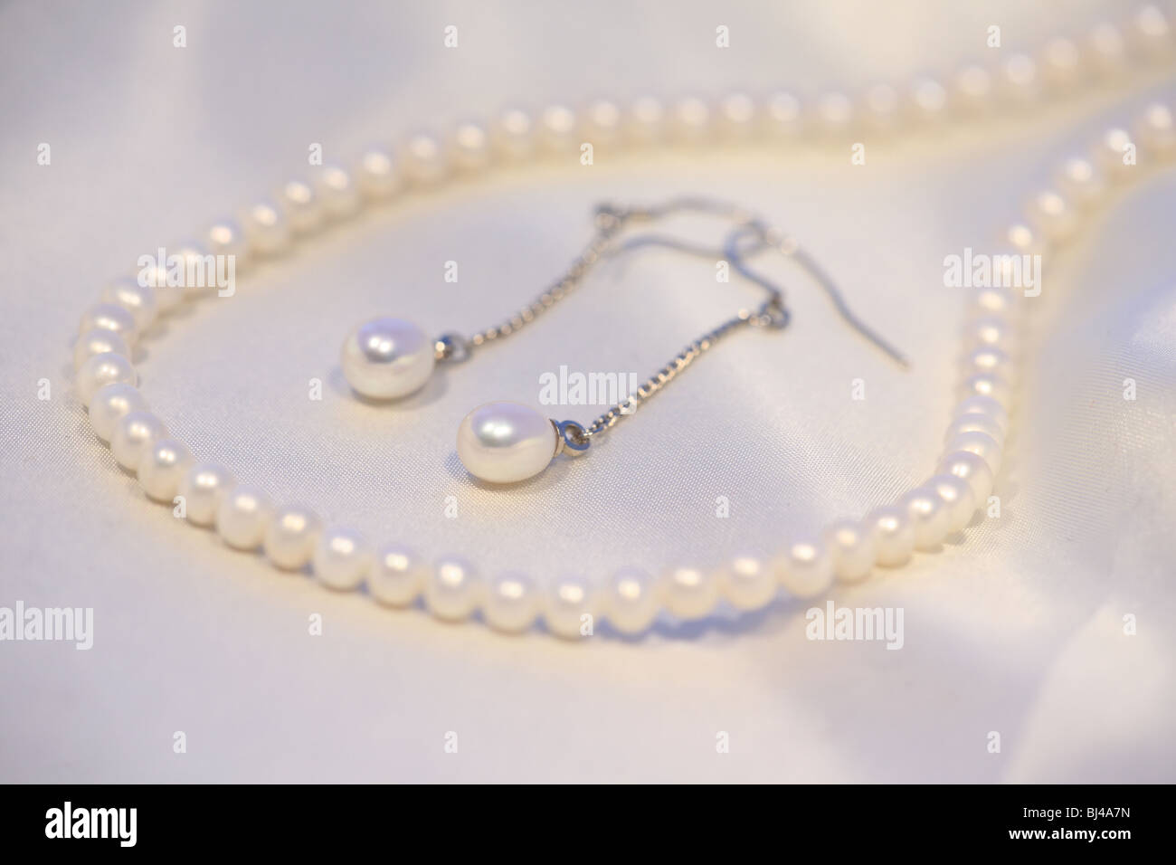 Pearl necklace and earnings Stock Photo