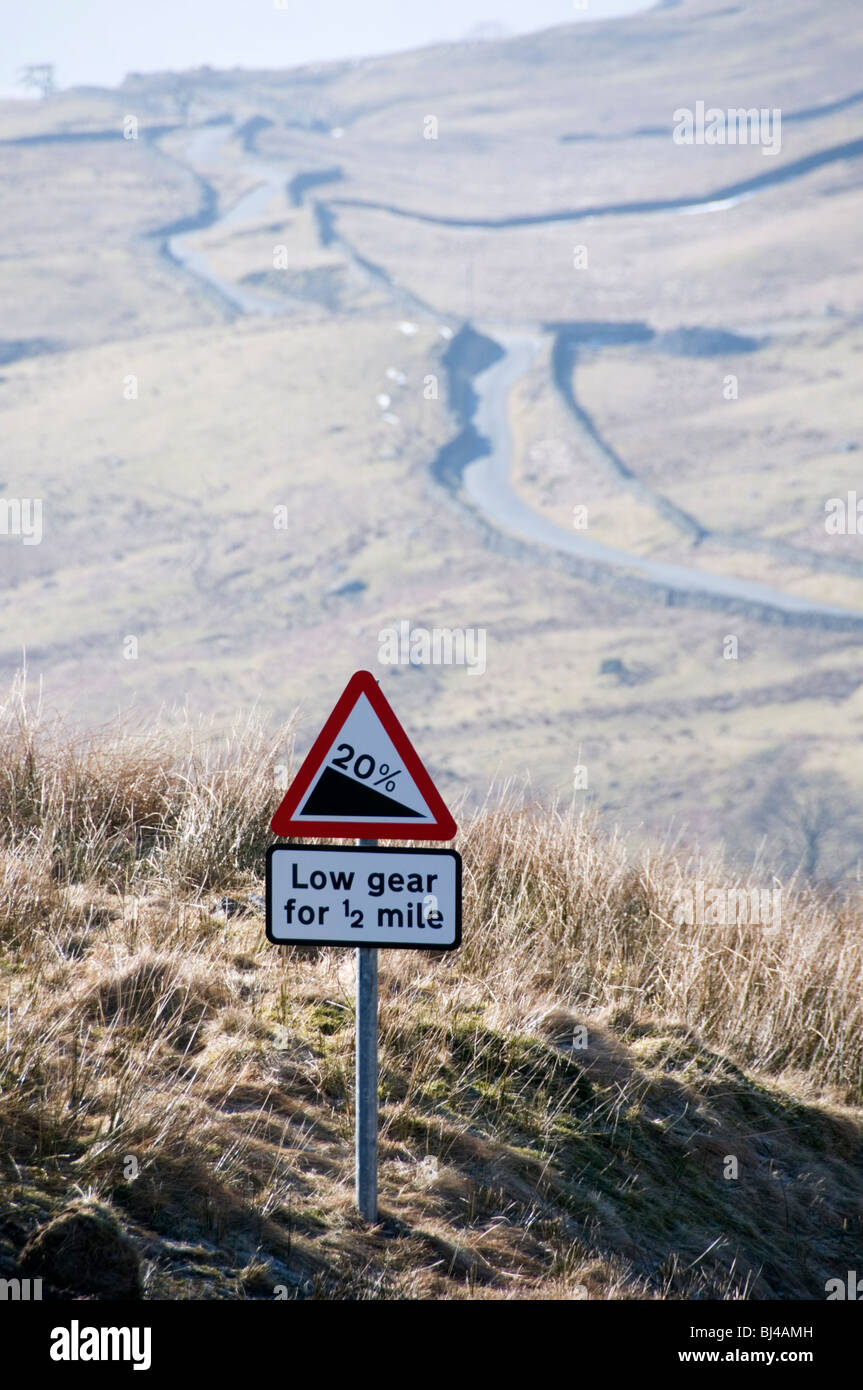 A steep hill road sign at the top of the road from Ambleside to the Kirkstone Pass in the Lake District, known as The Struggle Stock Photo
