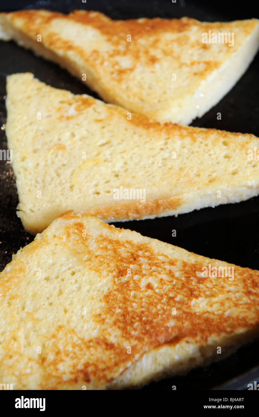 French toast or eggy bread frying in a pan Stock Photo Alamy