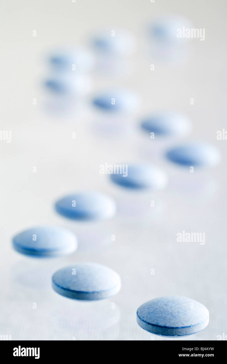 Line of blue pills Stock Photo