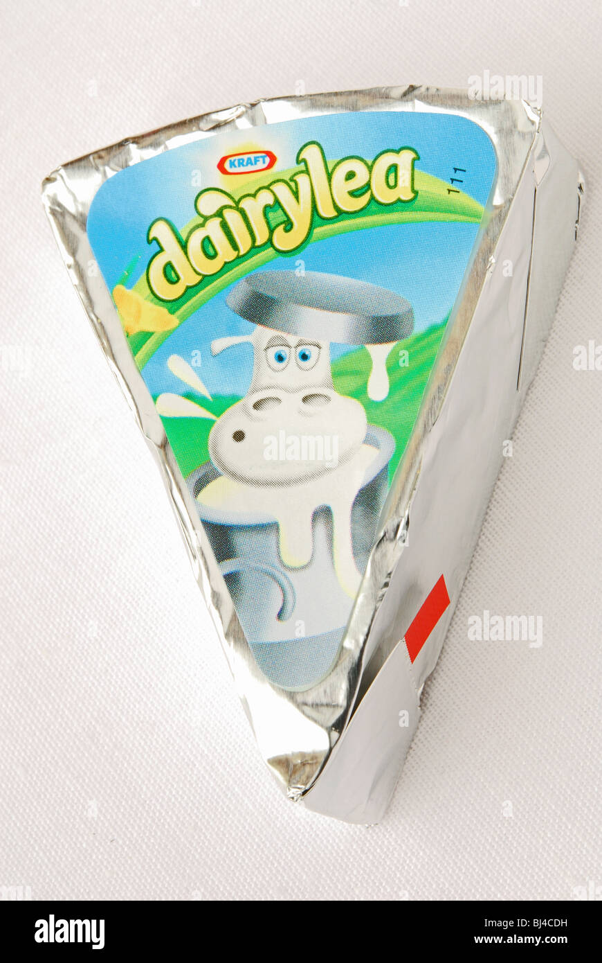 A single Kraft Dairylea cheese triangle in its wrapper Stock Photo Alamy