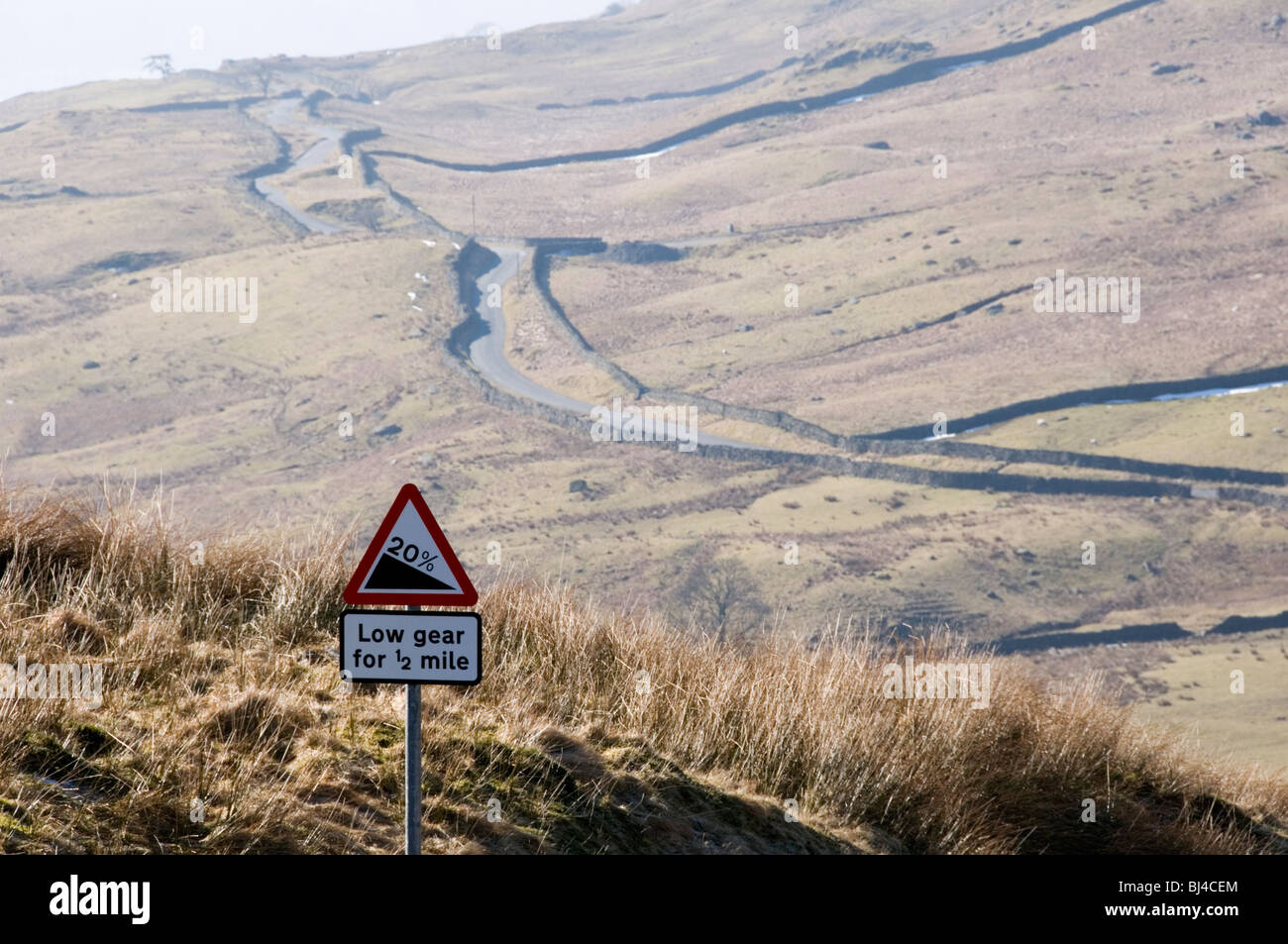 A steep hill road sign at the top of the road from Ambleside to the Kirkstone Pass in the Lake District, known as The Struggle Stock Photo
