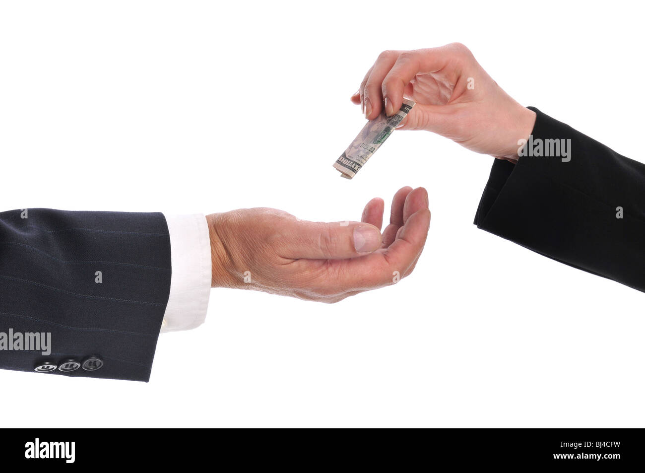 Woman's hand giving money to a businessman isolated on a white background Stock Photo