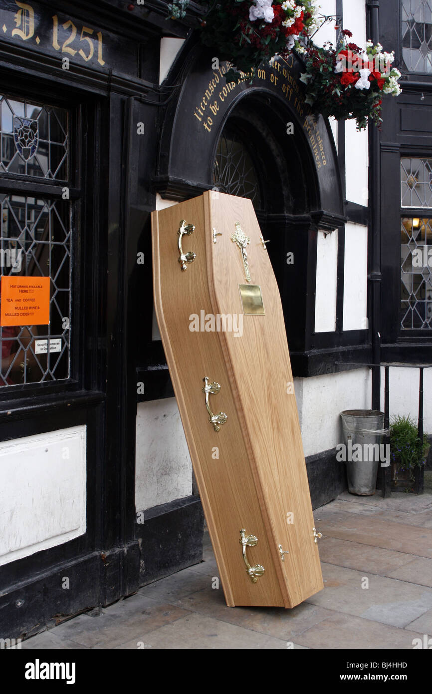 Coffin outside 'Ye Olde Man & Scythe' public house in Bolton, England  UK. Photo DON TONGE Stock Photo