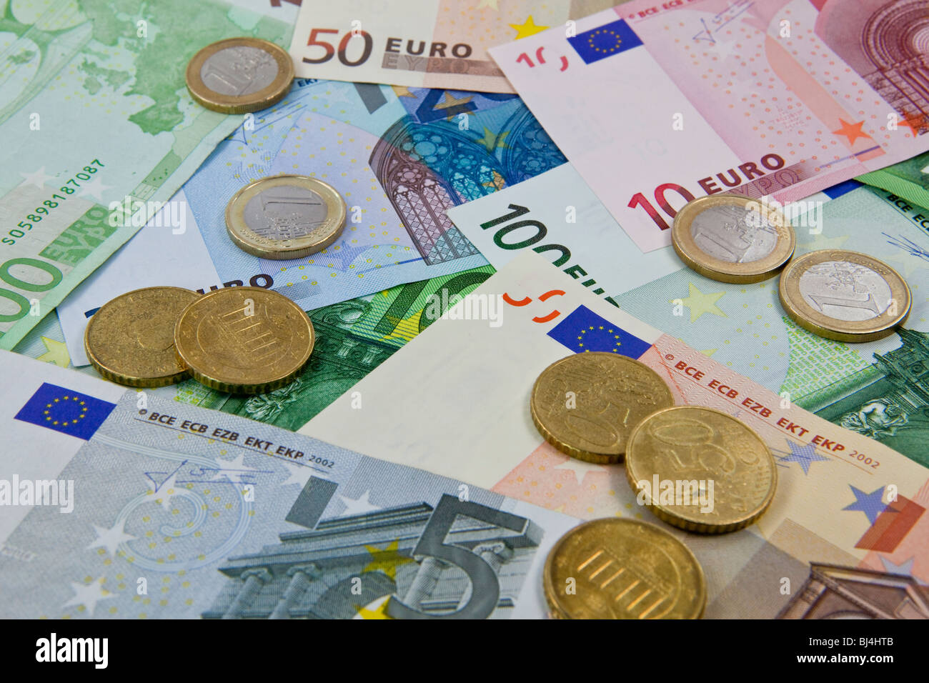 Euro bills and coins Stock Photo