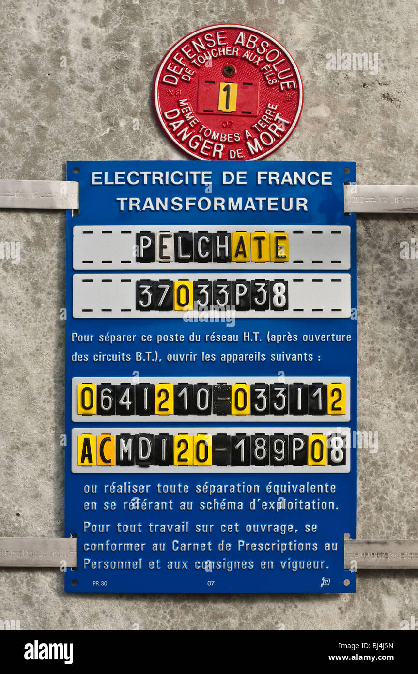 Warning notice on electricity power line - France. Stock Photo