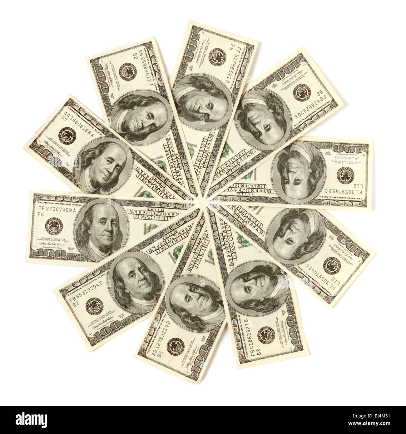 Artistic pattern made from dollar bills Snowflake or star Isolated with a clipping path on white background Stock Photo