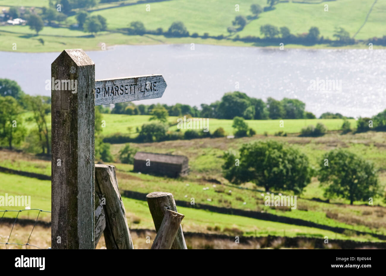 Wooden signpost at Semmerwater in Wensleydale in the Yorkshire Dales England UK selective focus Stock Photo